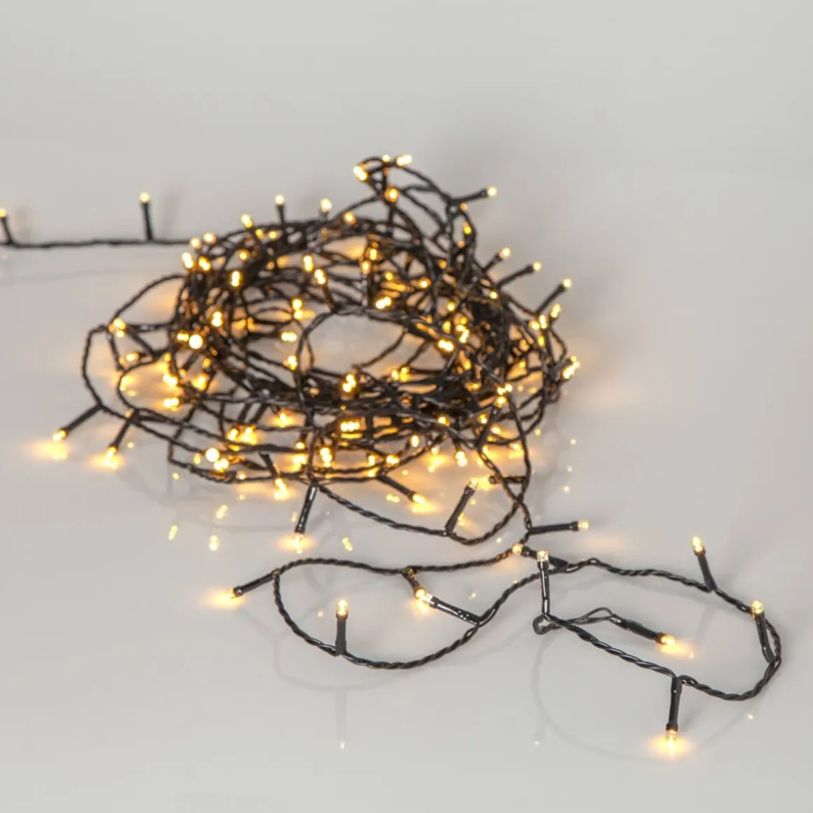 FLASHY Ljusslinga 7m 100LED Extra varmvit/Svart IP44